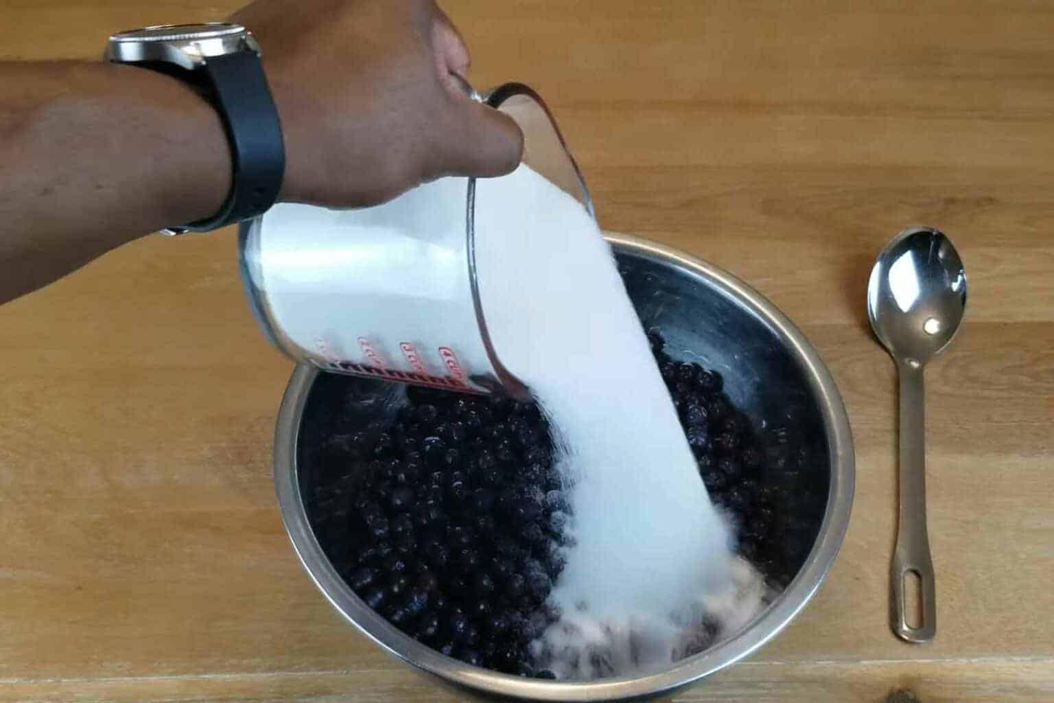 Put-the-berries-in-a-stainless-bowl-and-pour-the-4-and-a-half-cups-of-sugar