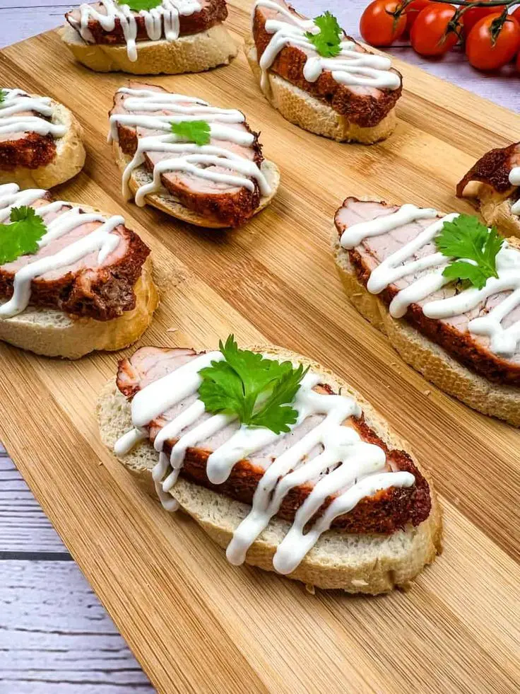 Spicy Pork Tenderloin Crostini With Lime Crema