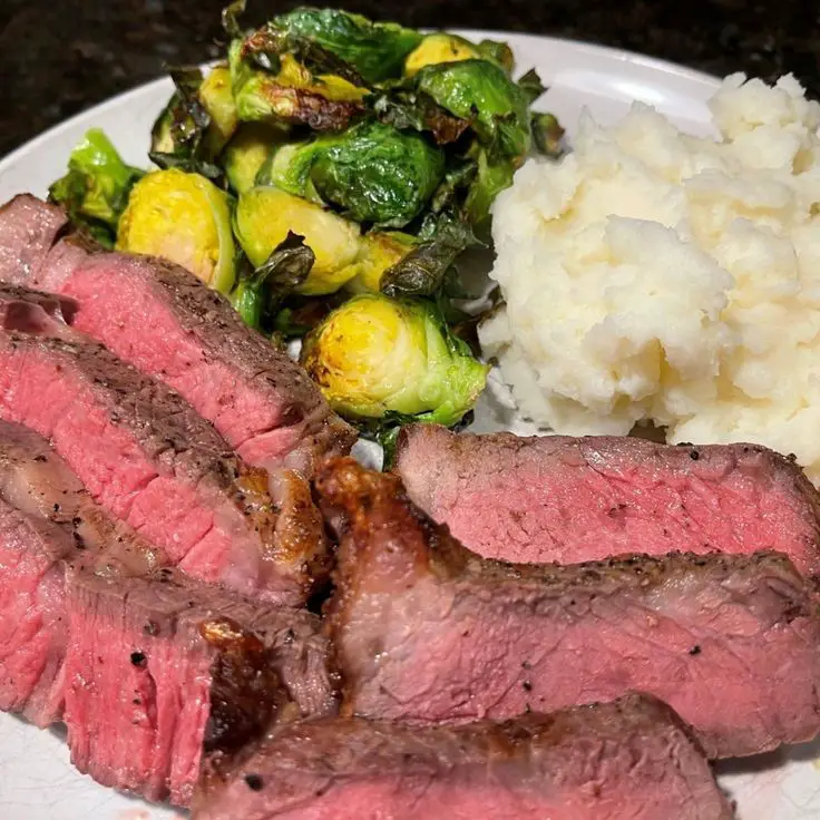 Angus Beef Ribeye Steak With Brussel Sprouts, Bacon, And Pan Sauce